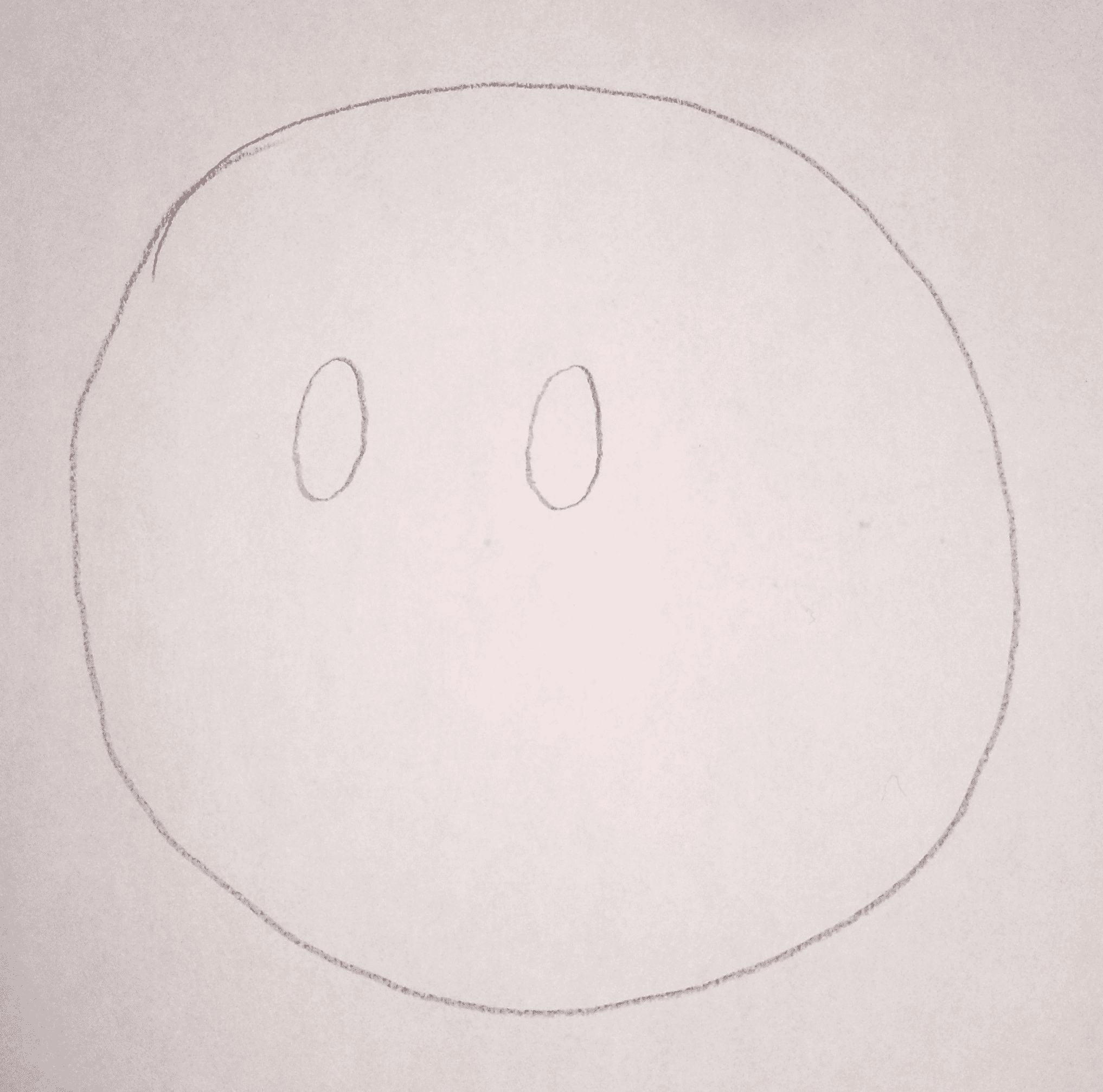Circle with two small black dots added as eyes in the upper portion
